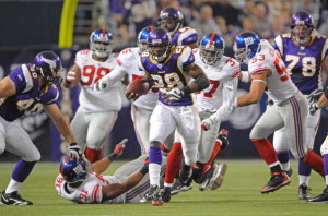 MINNEAPOLIS - DECEMBER 28: Adrian Peterson #28 of the Minnesota Vikings carries the ball on his way to a touchdown during an NFL game against the New York Giants at the Hubert H. Humphrey Metrodome on December 28, 2008 in Minneapolis, Minnesota.  (Photo by Tom Dahlin/Getty Images)