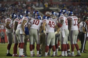 New York Giants quarterback Eli Manning (10) leads the team in the huddle during the third quarter of an NFL football game against the Tampa Bay Buccaneers Sunday, Nov. 8, 2015, in Tampa, Fla. (AP Photo/Phelan M. Ebenhack)