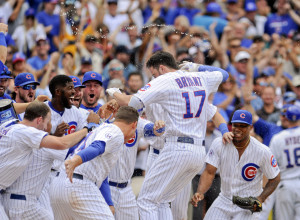 Chicago Cubs' Kris Bryant celebrates his walk off home run during the ninth inning of a baseball game against the Cleveland Indians on Monday, Aug. 24, 2015, in Chicago. The Cubs beat the Indians 2-1. (AP Photo/Matt Marton)