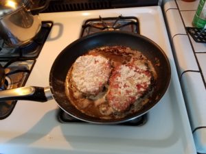 meat in pan 1st side