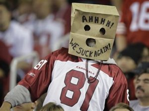 An Arizona Cardinals fan shows his opinion of the team during the third quarter of the Cardinals' NFL football game against the San Francisco 49ers on Monday, Nov. 29, 2010, in Glendale, Ariz. (AP Photo/Paul Connors)