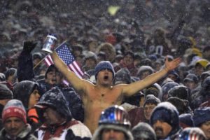 19 Jan 2002: A New England Patriots fan cheers for the team during the AFC playoff game against th
